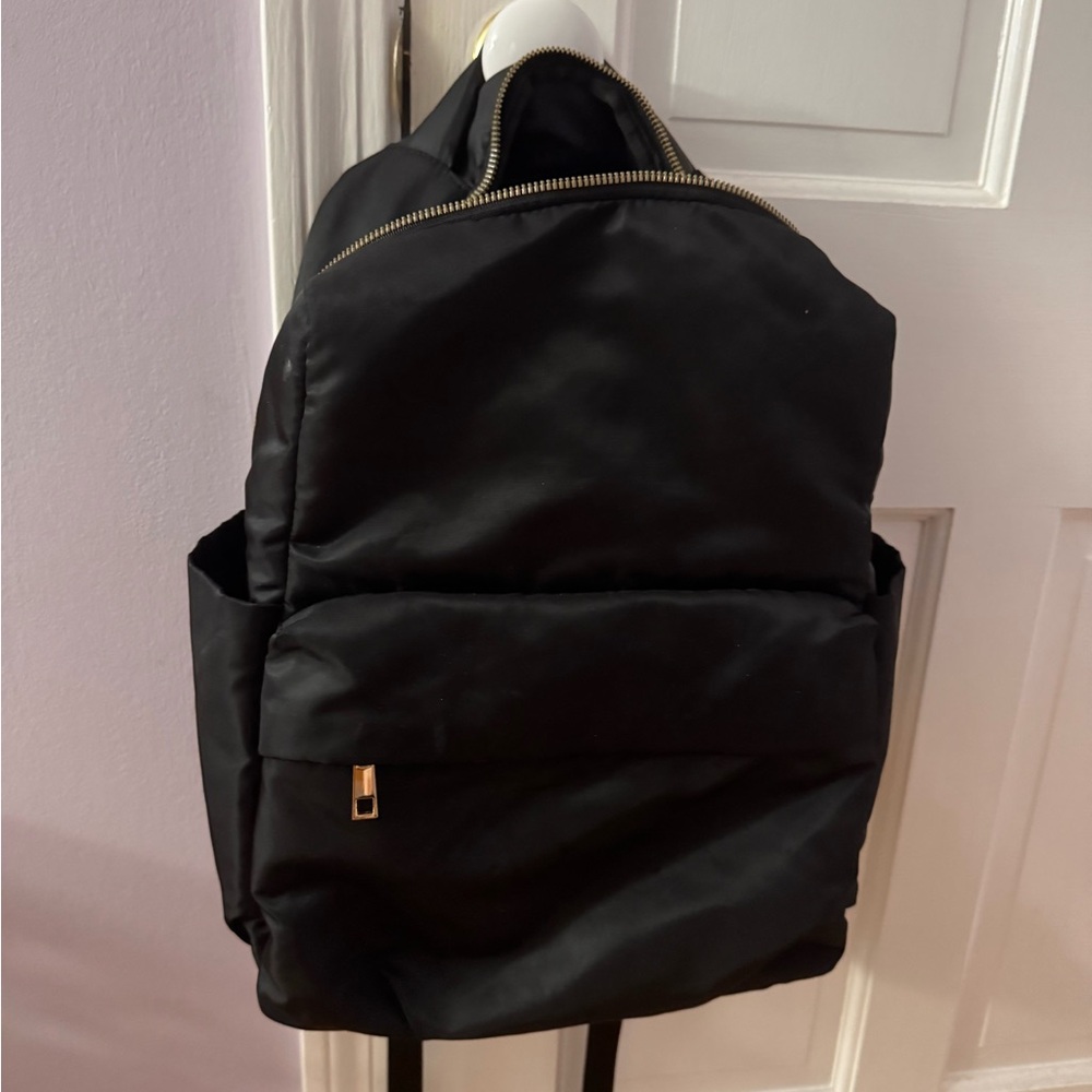a new day Black Backpack